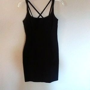 Little black dress. Has stretch. Cross strap back. Dry clean only. Acetate rayon